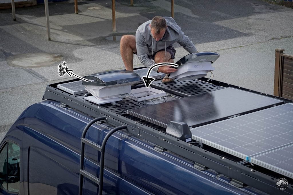 Swapping the roof fan on FarOutVan 2: the Maxxfan lifts out of the 14 x 14 opening between the solar panels and the AirPlus goes in